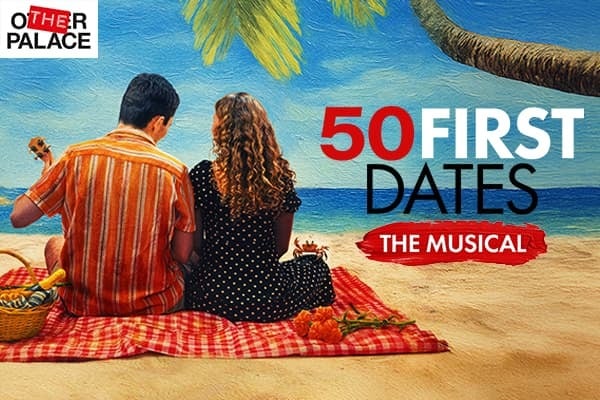 50 First Dates. A couple are sat on a beach looking out to the ocean