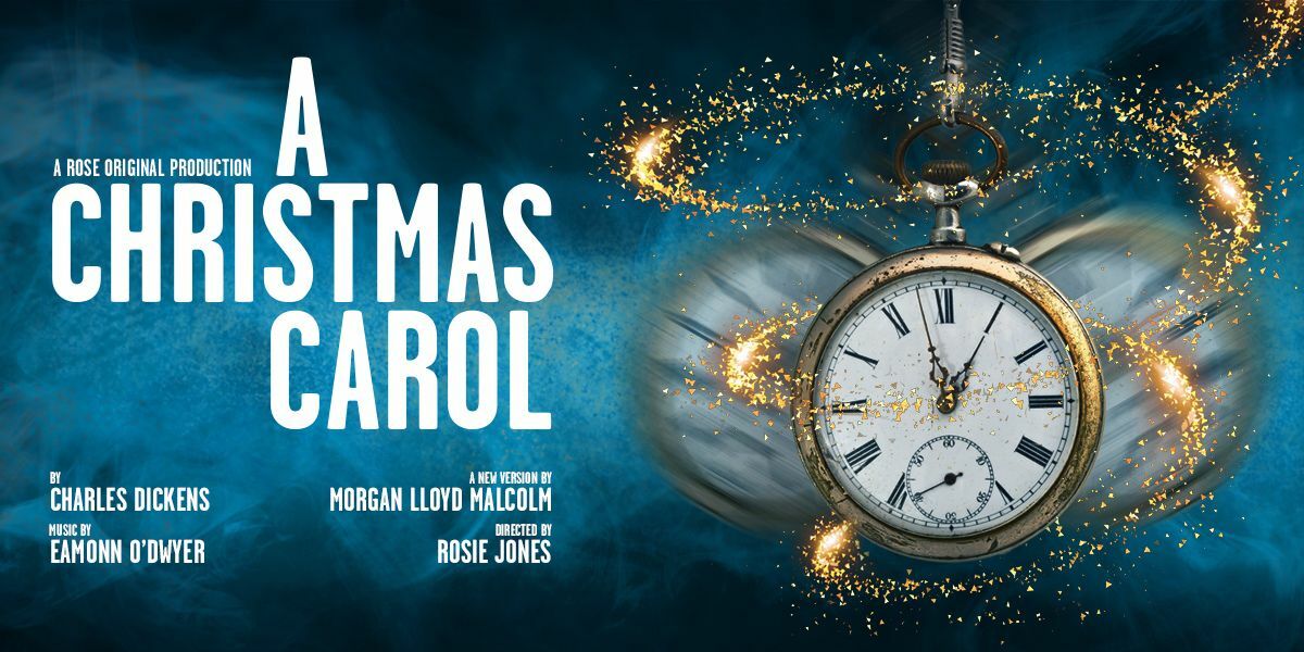 Text: A Rose Original Production. A Christmas Carol. By Charles Dickens. Music by Eamonn O'Dwyer. A new version by Morgan Lloyd Malcolm.  Directed by Rosie Jones. | Image: A pocket watch swings back and forth with a swirl of glittering gold surrounding it. 