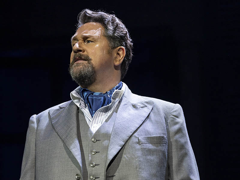 Michael Ball wearing a suit and cravat.