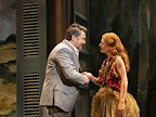 Man and woman greeting each other by shaking hands.