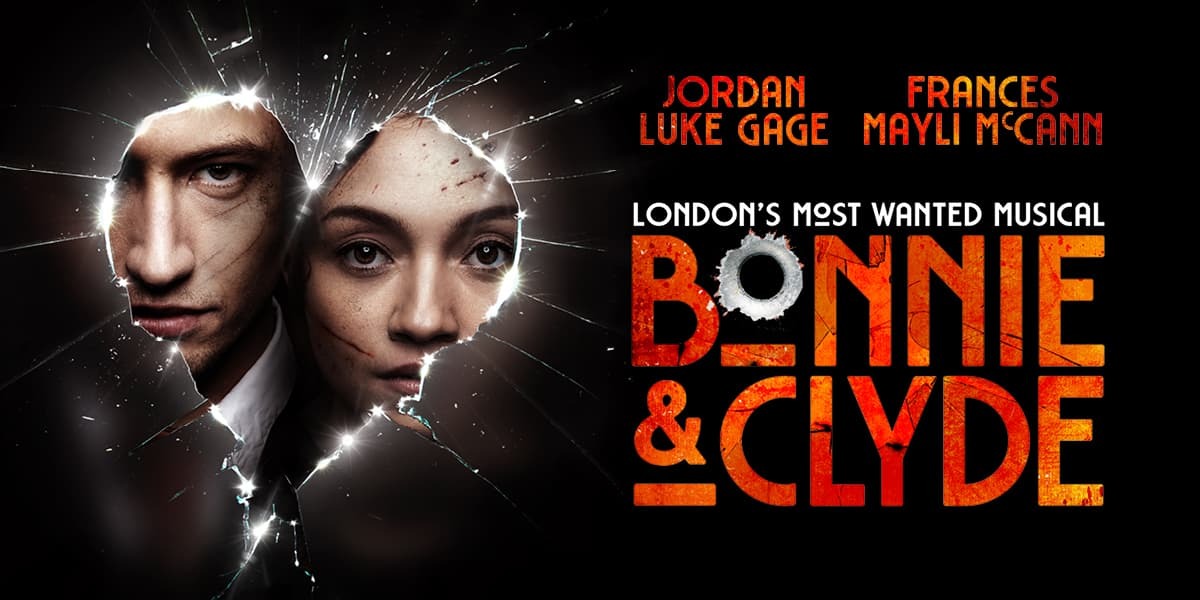 Black background. Broken glass in the shape of a heart. In the heart are the blood-spattered faces of Jordan Luke Gage and Frances Mayli McCann as Bonnie and Clyde. Text: London's Most Wanted Musical (underneath) Bonnie & Clyde (the O in Bonnie is a bullet hole).