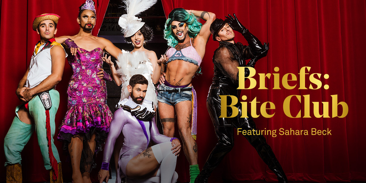 Text: Briefs: Bite Club, Featuring Sahara Beck | Image: Red velvet curtains are slightly parted. In front stands a lady in feathers surrounded by five men in dazzling outfits.