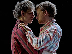 Two men embracing each other.