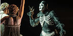 Man in black garmet and pearls from Cabaret at the Kit Kat Club,