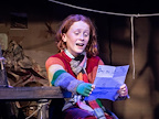 Charlie Bucket reading a letter to Mr Willy Wonka.