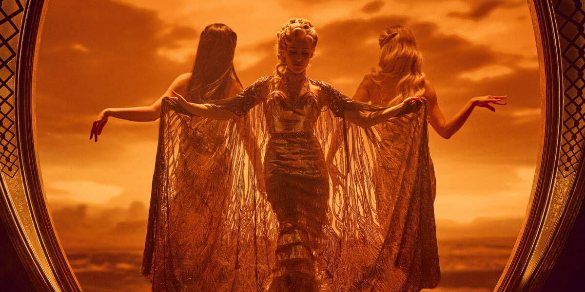 Diamonds and Dust in London - Three women in gold gowns posing in front of a gold background