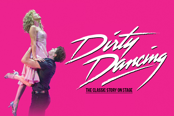 Text: Dirty Dancing. The Classic Story on Stage. | Image: pink background, Johnny dressed in black shirt and trousers is facing the left and holding 