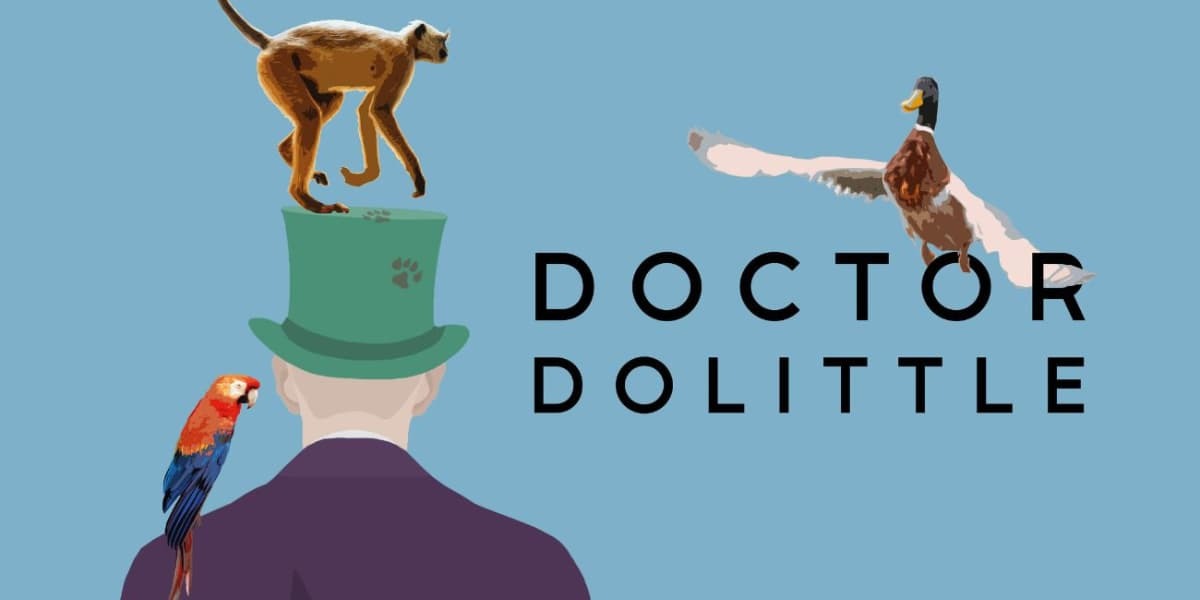A man in a purple blazer and green top hat has his back to us. On top of his hat sits a monkey, and a parrot is perched on his shoulder. A goose is flying behind the title 'Doctor Dolittle'.