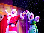 Father Christmas with his arms up 