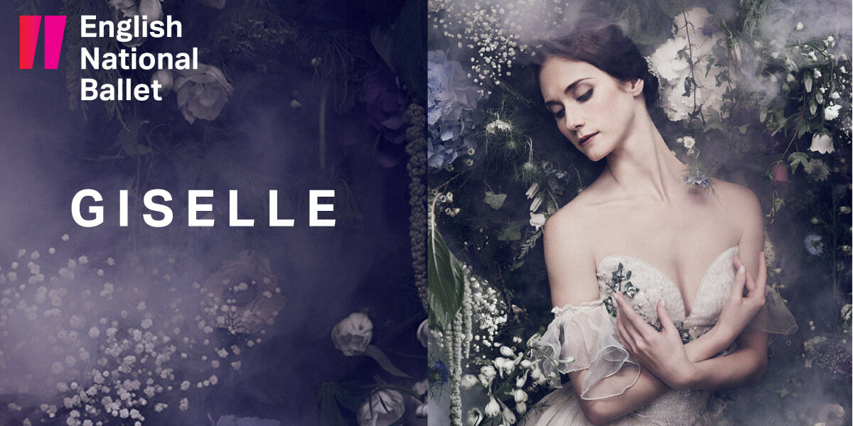 The English National Ballet logo sits in the top left corner. Giselle IMAGE: A Woman in white poses gracefully, arms crossed,  hands pointing up toward her shoulders. She is standing in a bower of flowers.