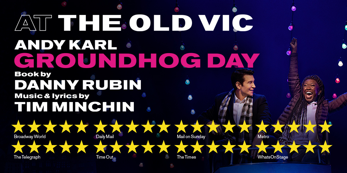 Text: At the Old Vic Groundhog Day. Book by Danny Rubin. Music and Lyrics by Tim Minchin. Image: A man and woman in a fairground ride, the woman has her arms in the air.