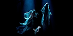 Two dementors float in darkness above Scorpius.