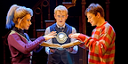 Delphi, Scorpius and Albus stand around an open book, as the timeturner hovers above it.