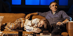 Show: Interview at Riverside Studios Image: Two people lounging on their sofa