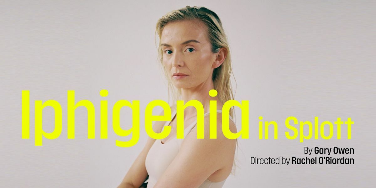 Text: Iphigenia in Splott. By Gary Owen. Directed by Rachel O'Riordan. | Image: A woman stands to the side and faces forward. Her arms are crossed and her clothes are neutral which blends with the background.