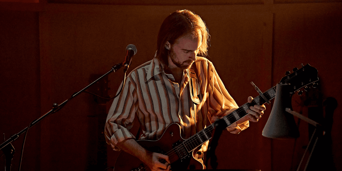 Image: Jack Holden playing guitar Show: Kenrex