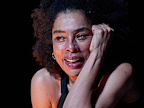 Woman with tears rolling down her face