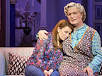 Mrs Doubtfire comforting Miranda Hillard on the sofa