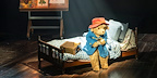 Paddington on a bed scene, part of the London family theatre show.