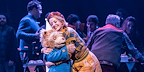 Paddington bear hugs Mrs Brown on stage in the West End production.