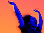 Shedding A Skin at Soho Theatre in London. A Woman raises her arms in joy. 