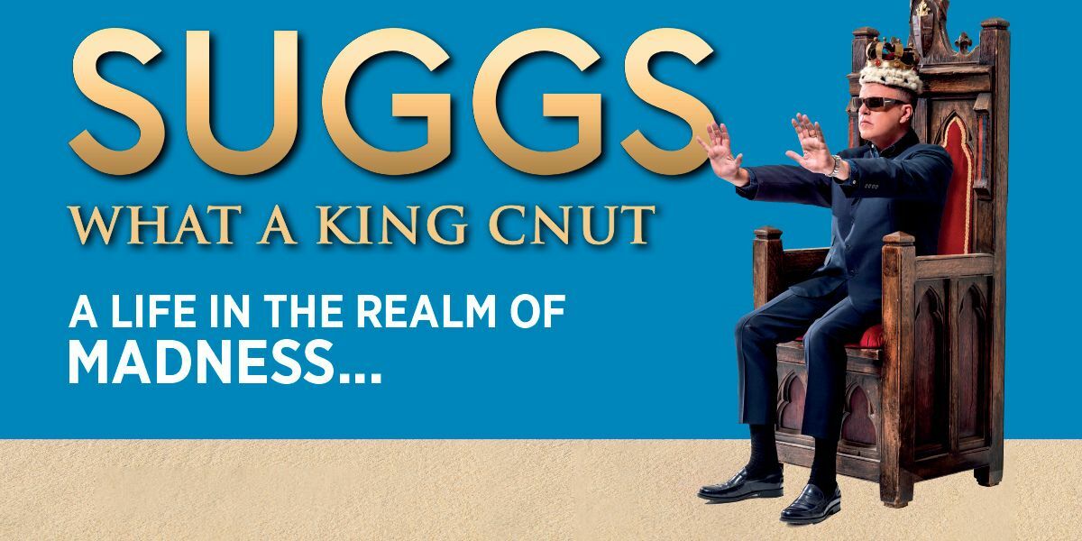 Text: Suggs. What A King Cnut. A life in the realm of madness... 
| Image: A man wearing a suit, a crown and dark glasses sits in a throne and has his arms stretched out in front of him. 