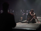 Man and woman sat on floor embracing