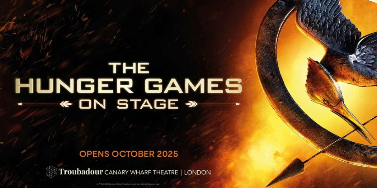 The Hunger Games on stage logo, featuring the words 'The Hunger Games' alongside the iconic mockingjay bird engulfed in flames.
