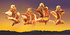 Dancers dressed as lions leap through the air in a dynamic moment from The Lion King musical in London.