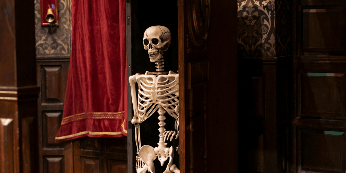 Skeleton coming out the closet in The Play That Goes Wrong
