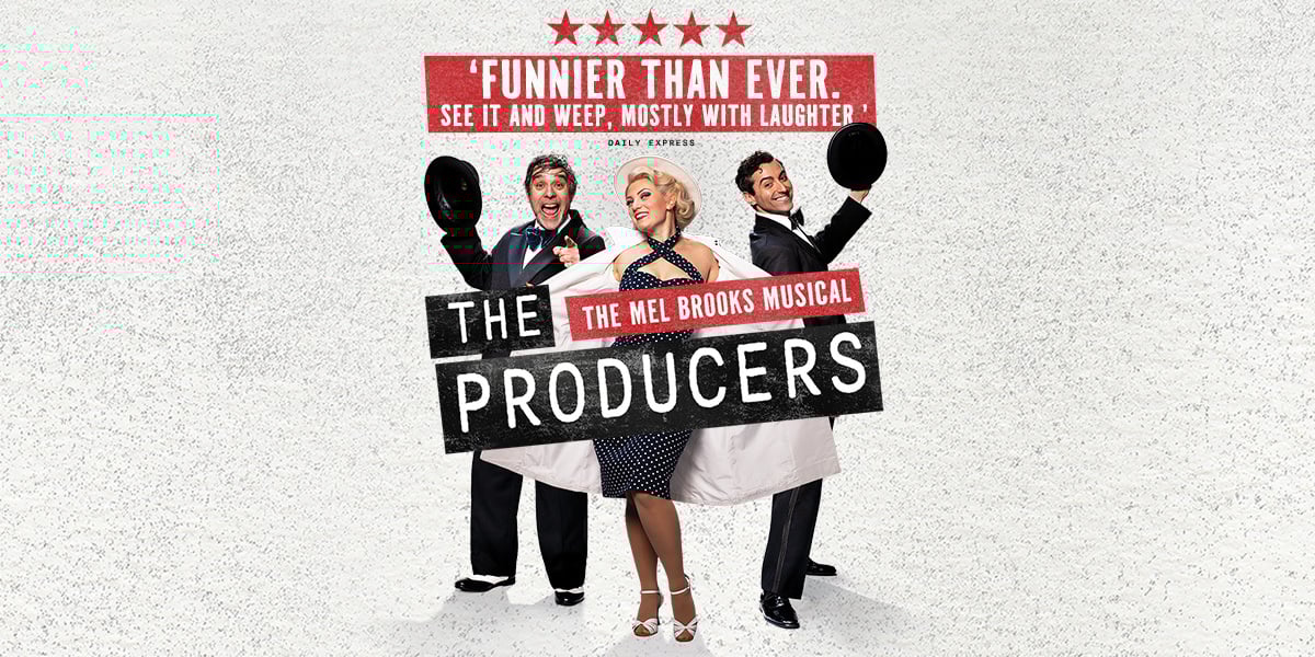 The Producers - The Mel Brooks Musical. Three cast members pose behind the show title, two suited men holding out their bowler hats on either side of a blonde woman in a polka dot dress holding open her coat. 