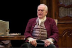 Brian Cox sitting down