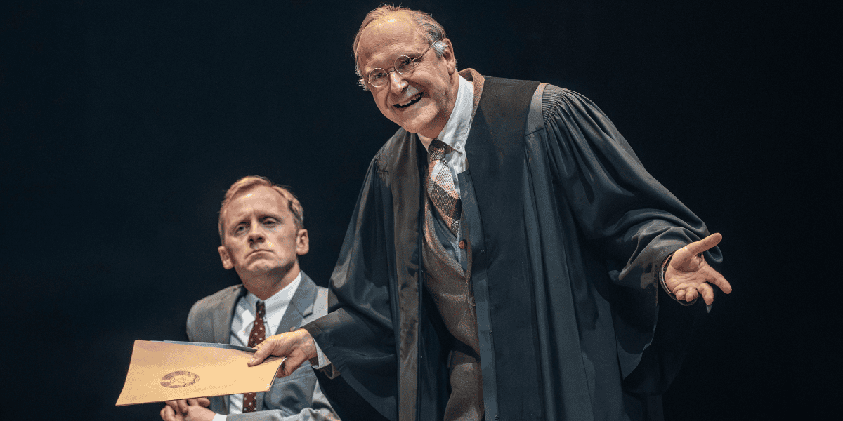 Man in cloak waving documents from The Spy Who Came In From The Cold