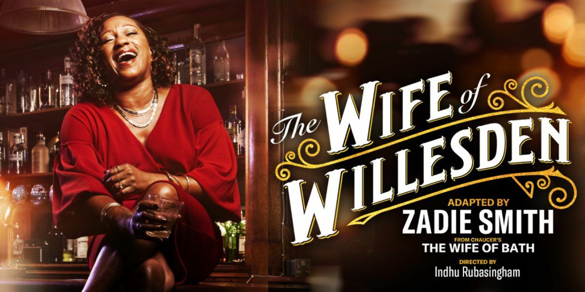 Alvita (Clare Perkins) sits on a bar wearing a red dress, legs crossed drink in hand, her head thrown back in laughter. TEXT: The Wife of Willesden Adapted By Zadie Smith from Chaucer's The Wife of Bath Directed by Indhu Rubasingham