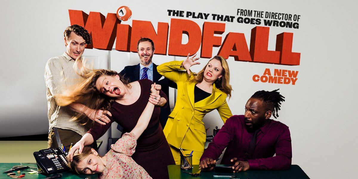From The Director of The Play That Goes Wrong, Windfall, A New Comedy by Scooter Pietsch. Southwark Playhouse, 9 Feb - 11 Mar 2023. Tickets on sale now. Image: The company of Windfall in an office setting, looking chaotic. One woman is holding another womans head on a table. The others are all watching with different expressions on their faces.