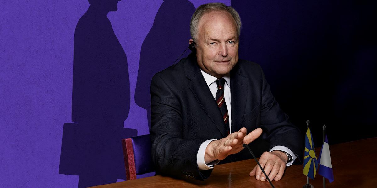 Winner's Curse, Clive Anderson presenting with two shadows in the background.