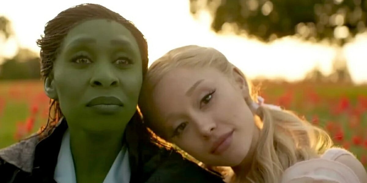 Cynthia Erivo and Ariana Grande sit in a field of poppies in Wicked For Good the movie