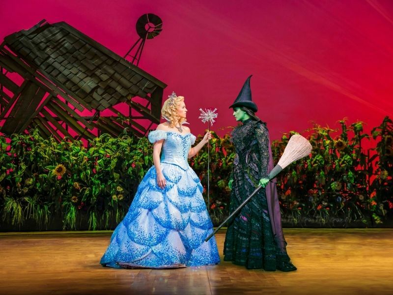 Production shot of Lucie Jones as Elphaba and Helen Woolf as Glinda in Wicked in London