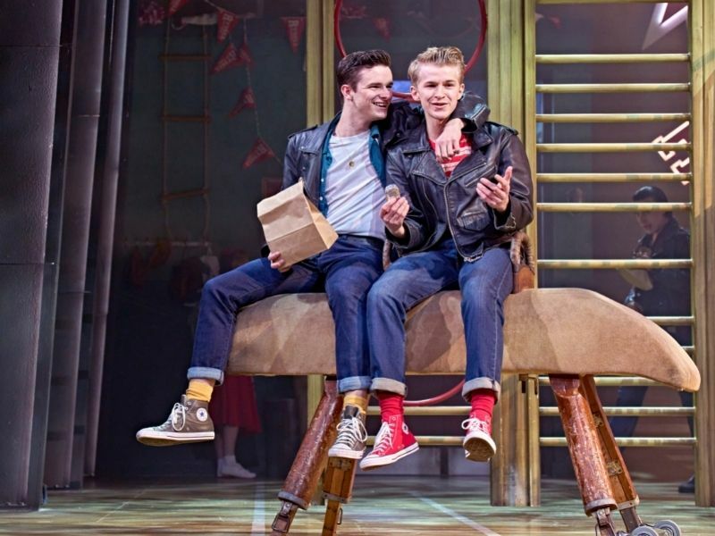Production image of LtoR Noah Harrison as Roger and Jake Reynolds as Doody in GREASE in London | credit Manuel Harlan