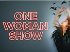 A performer in a dramatic pose is surrounded by flying birds. The text reads, "One Woman Show."