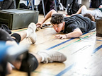 Rehearsals for From Here To Eternity, male cast members crawling along floor. Photo by Pamela Raith.