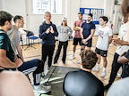 Rehearsals for From Here To Eternity. Cast members huddled together. Photo by Pamela Raith.