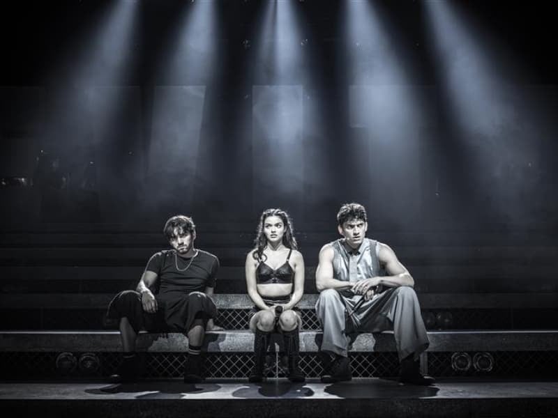 Diego Andres Rodriguez, James Olivas and Rachel Zegler in Jamie Lloyd's Evita