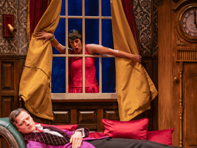 The play that goes wrong photo, cast through window.
