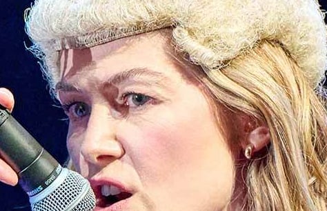 Rosamund Pike in a traditional judge