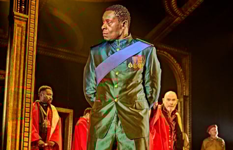 David Harewood looks stern in a green military uniform in Othello